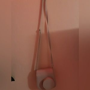 a polaroid camer case with strap.